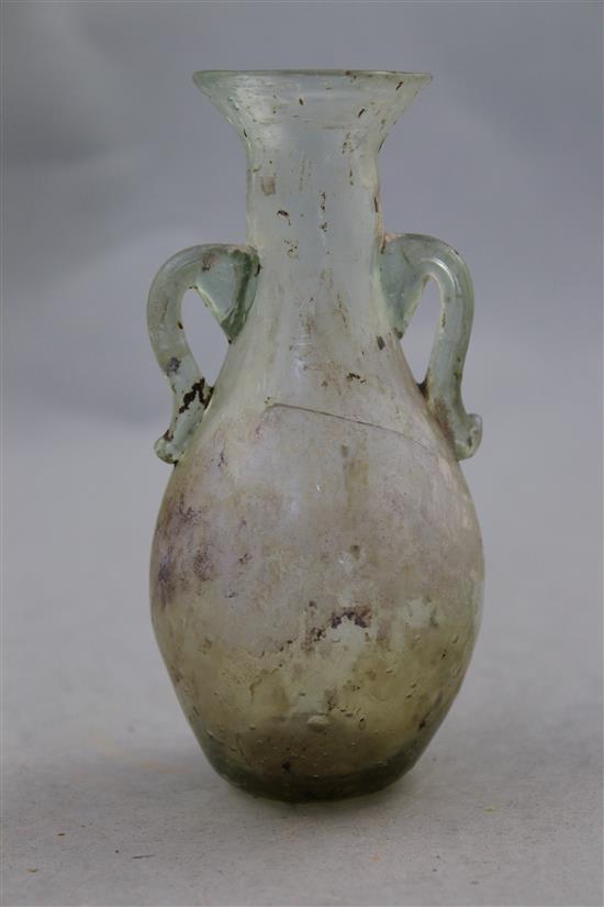 A Roman clear glass two handled bottle vase, c.2nd century AD, 12.5cm